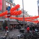 Reguliersdwarsstraat decorated with orange balloons and a huge national flag